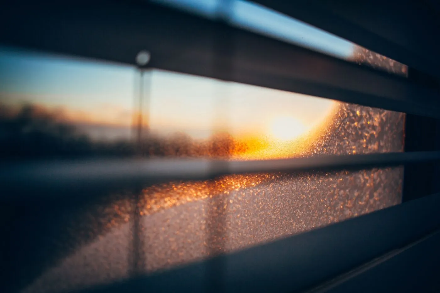 Golden morning light seen through a frosted window